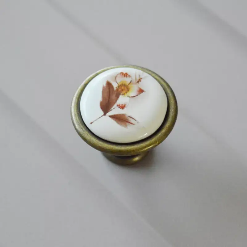 Vedd meg online Fém-porcelán bútorgomb, bronz színű, barna virág motívummal