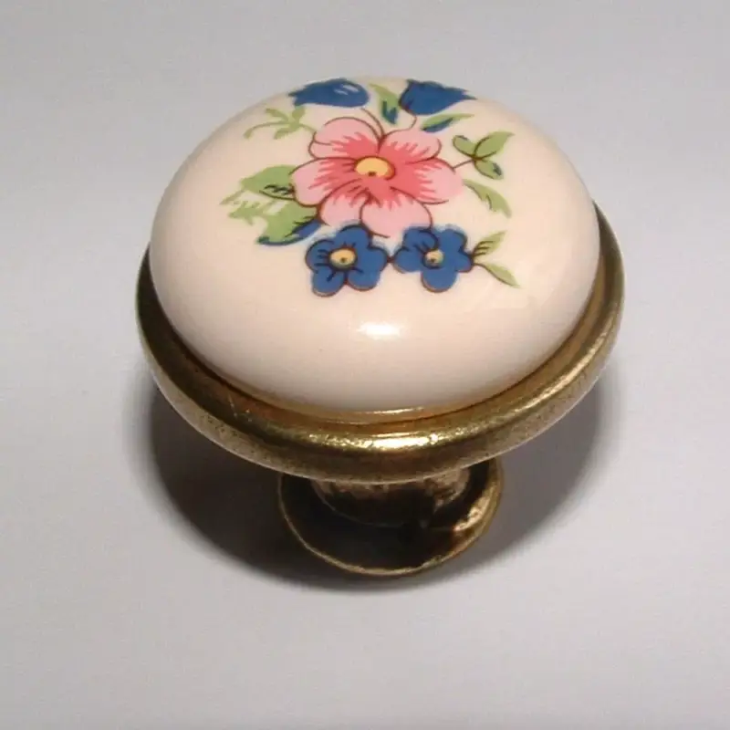 Porcelán-fém bútorgomb, fehér - bronz színű véggel, virág motívummal Biztonságos fizetés