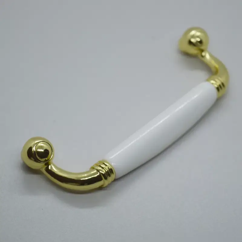 Metall-Kunststoff-Möbelgriff, Farbe gold-weiss, Bohrung 96 mm Kedvezményes ár